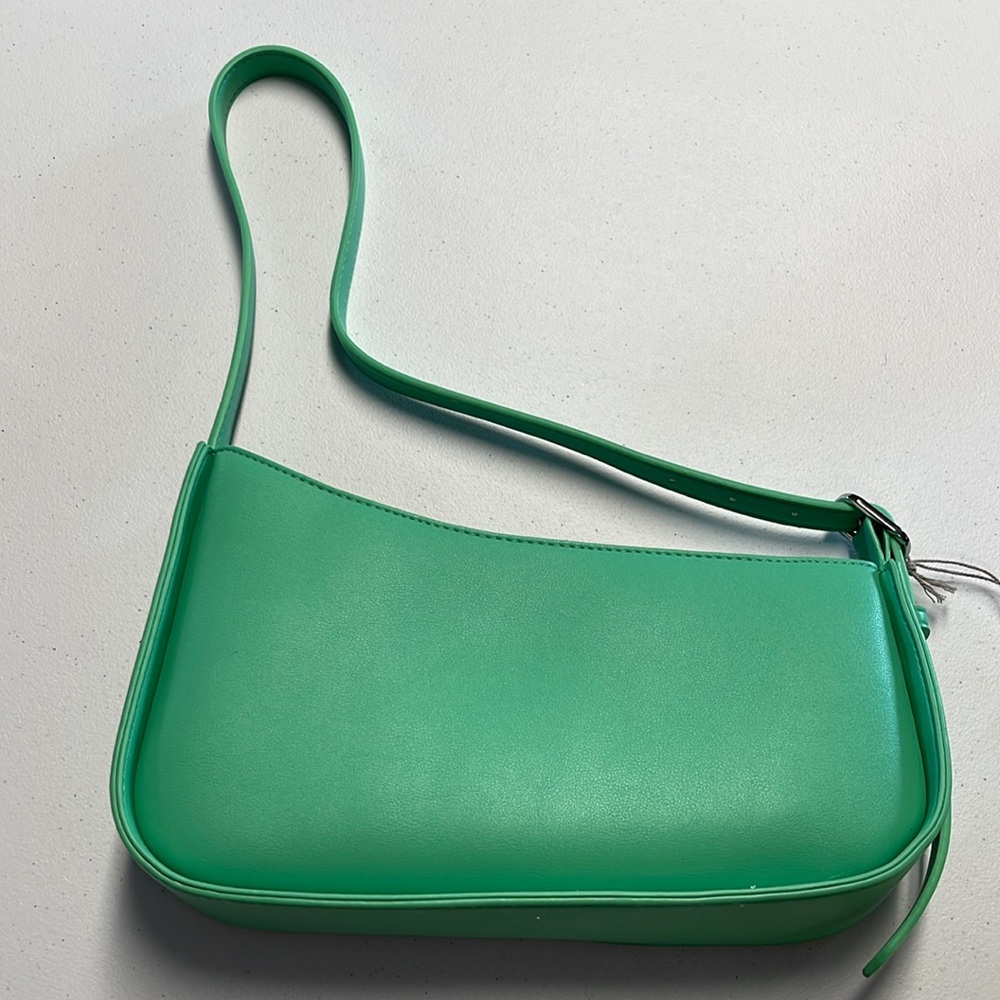 A New Day Green Purse adjustable strap length with inside zippered pocket. NWT